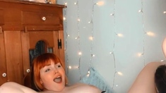 Sexy brunette lesbian riding a big strapon