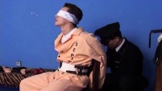 Blindfolded prisoner has a horny guard roughly plowing his tight ass