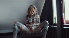 Gorgeous tattooed girl fucks her ass with a big dildo