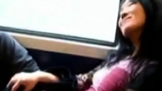 Asian milf rubs her clit on a train.