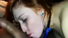 Collared and leashed redhead worships cock and balls