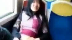 Asian milf rubs her clit on a train.