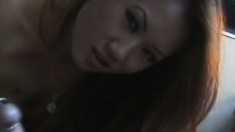 Slutty Redheaded Asian Broad Shows How Much She Loves To Suck Penis