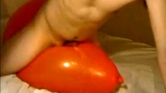 Big inflatable orange balloon humping cum